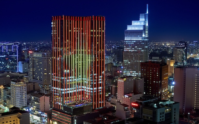 night view picture of a hotel in a busy city