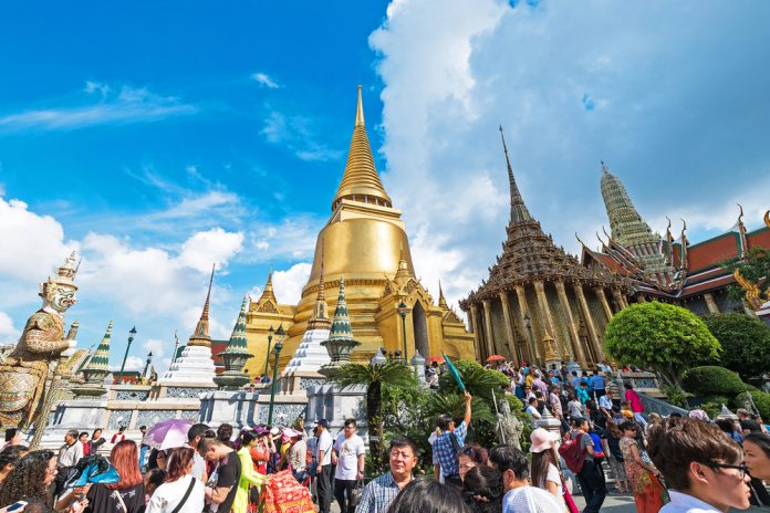 Unidentified tourists at Wat Phra Kaew on Jan 9 2016 in Bangkok, Thailand